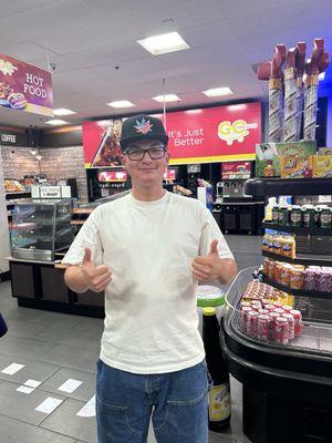 My friend giving a thumbs up to the hats