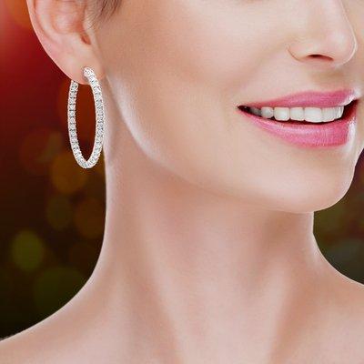 Save thousands of dollars with jewelry from Mystique! Diamond Quality Cubic Zirconia Hoop Earrings starting at $475.00