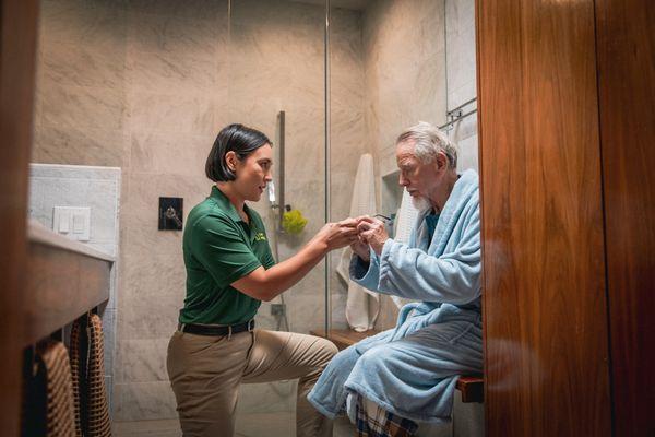 Home Instead Care Giver and their client getting ready for the day