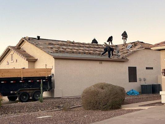 Continued re-roofing from one side by T Johnston & H Johnston