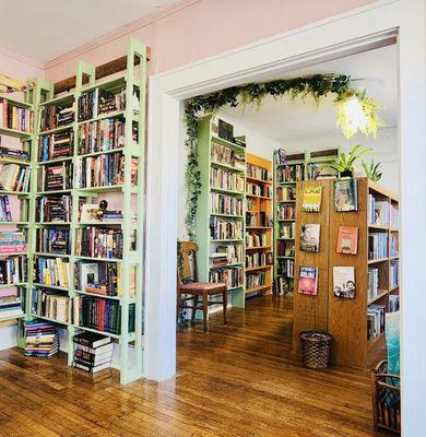 A view of the Beautywood Nonfiction room, with vines hanging from the ceiling.