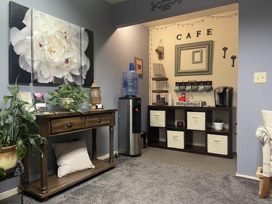Waiting area with complimentary water and coffee