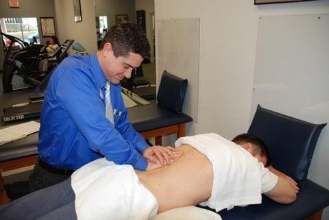 Clinic Director Chris Roosa working on a patient