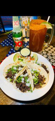 "Barbacoa Taco Order" 4 Soft corn barbacoa tacos topped with fresh cilantro and onions with our home made Avocado Cream Sauce.