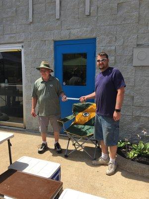 Passing of the torch. Harold passing the wrench to the new owner Dave.