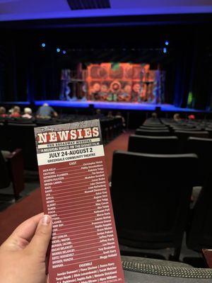 Newsies program with stage in background