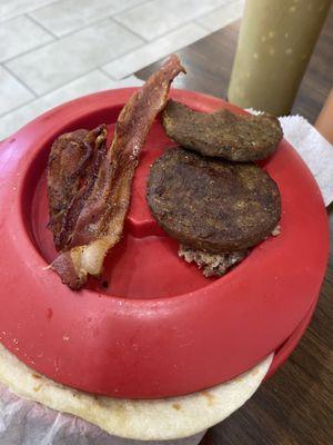 At least 2 day old sausage patty and old greasy bacon.