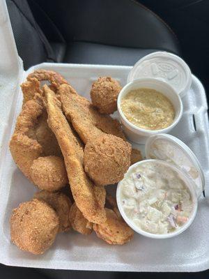 Fried catfish filets (3) with cheese grits hush puppies and coleslaw