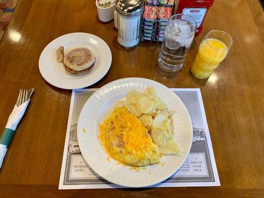 Ham and Cheese Omelet* Cottage-Fried Potatoes, English muffin, water and Orange Juice