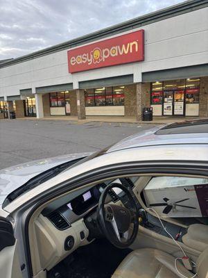 The damn parking lot of the worst pawnshop I have ever been in