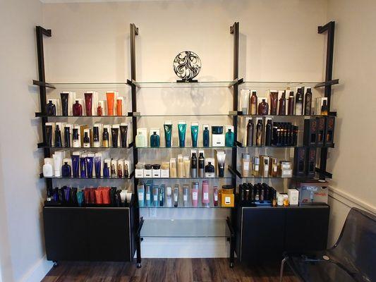 Tempered glass shelves for hair studio display.