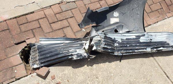 Exposed wires of downed light pole.
