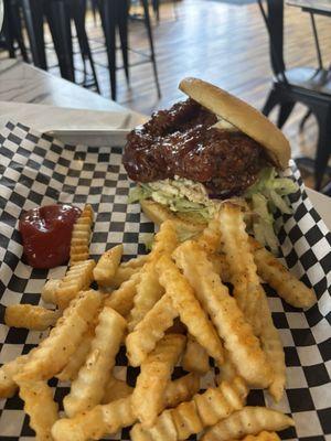 Fried chicken sandwich with bbq sauce and fries