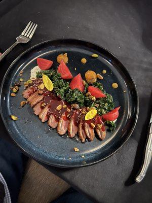 Duck Breast with kale and pickled beets.