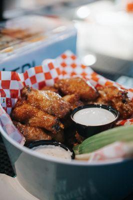 Whether you go classic buffalo, siracha BBQ, or garlic parm, each wing is perfectly cooked with a golden, crispy skin and tender, juicy meat