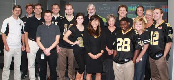 Bellwether staff ready for the Saints game on Monday Night Football. Who Dat!