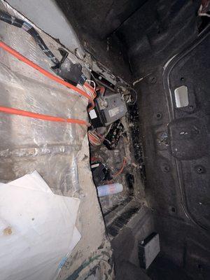 Trashed battery and fuse box, exposed wiring