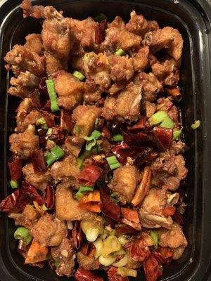 Chongqing Spicy Chicken. 1/10th of each piece was meat, the remaining 9/10th was all bone/flabby skin. Not worth the $15.95