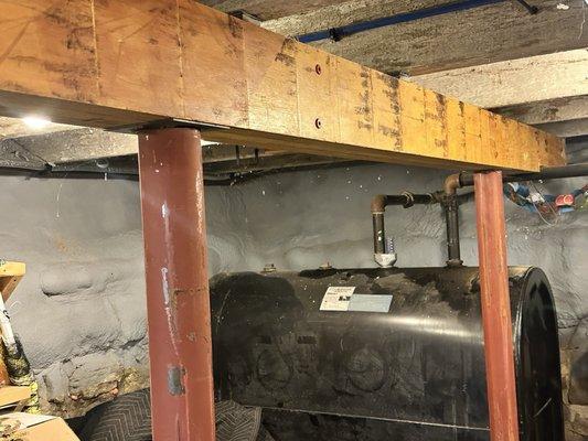 Supplemental support with new posts - notched the beam to work around the oil pipe.