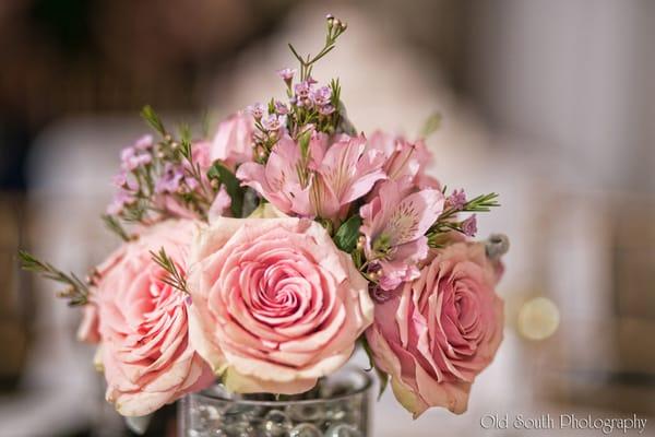 A lovely bridesmaid's bouquet repurposed as a reception table centerpiece