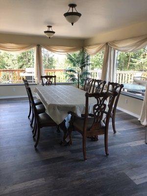Main floor dining area with large picture windows.