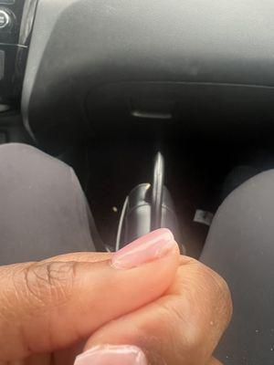 Entire nail wasn't covered, nail was uneven and "chipped"/not painted properly