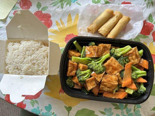 Tofu and Broccoli with spring rolls.