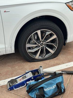 Flat tire before Misael fixed it.