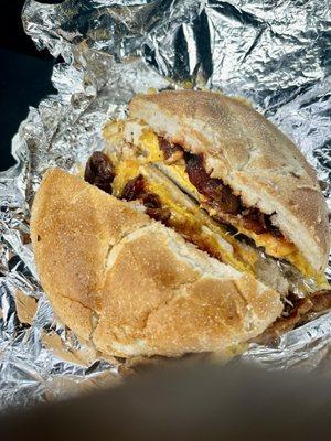 Bacon egg n cheese salt pepper ketchup on a hard roll