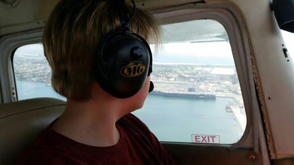 Checking out Nimitz class aircraft carrier while flying over San Diego Bay during introductory flight lesson.