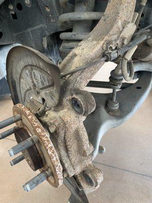 This is the knuckle and hub.  Had to beat the rotors off with a hammer from all of the oxidation.