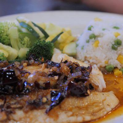 Pescado Al Ajillo (Sea Bass with buttery garlic sauce and guajillo peppers.