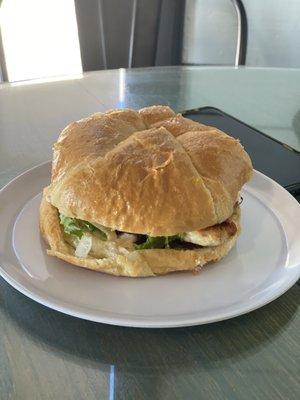 Grilled chicken sandwhich on croissant.