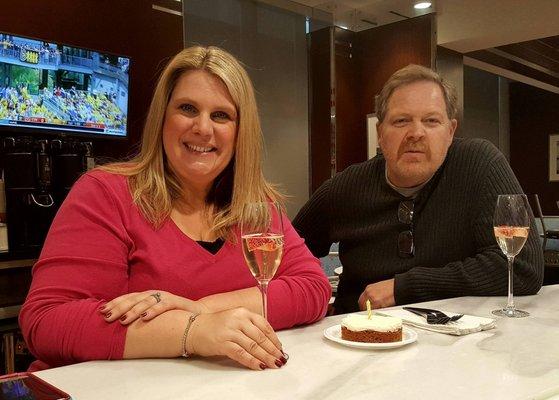 Champagne and carrot cake to celebrate a guest's birthday.