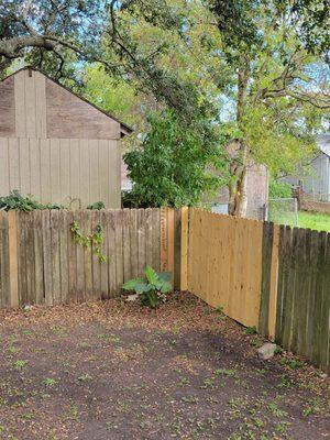 Fence repair after Hurricane Ida