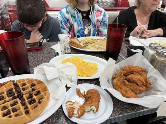 Waffle with chocolate chips, chicken nuggets egg with cheese