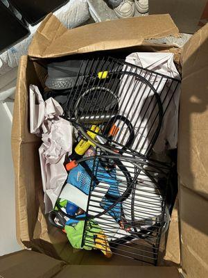 Shoes, bath, and bike items thrown into a box together without protection.
