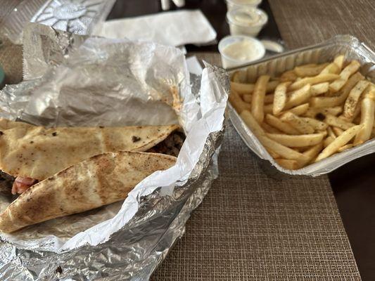 Two of these wraps and one order of fries seen here with no drinks was $40. Wayyyy too expensive.