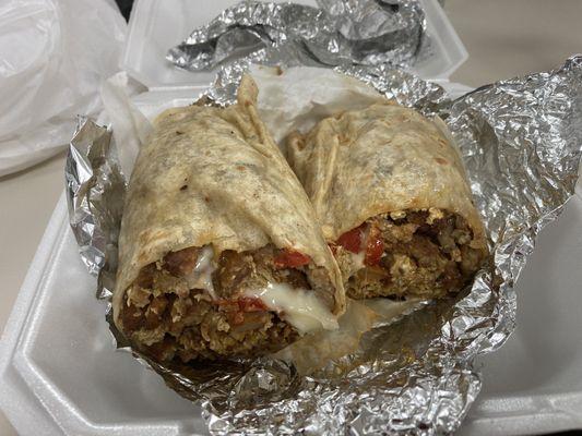The absolutely massive breakfast burrito! Loaded with meat, peppers, onions, and home fries.