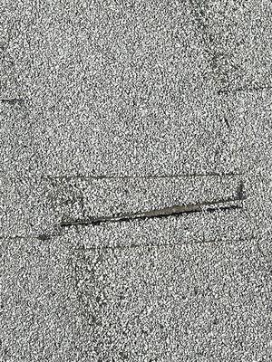 Does that look like a professional installed this roof. There is areas all over the roof like this. They refuse to make it right.