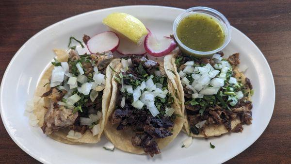 From left to right, carnitas, cabeza, and asada