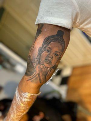 Tattoo portrait of her daughter on inner arm Done by FrenchysTattoos female tattoo artist