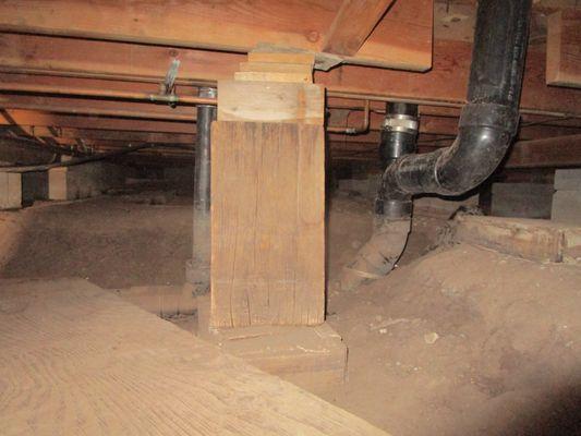 Crawlspace conditions. Improper added supports identified.