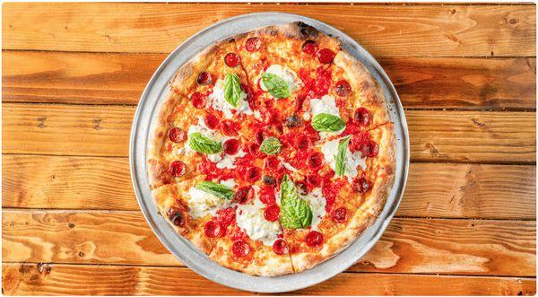 Bonefire Pizza--Pepperoni, finished with creamy burrata, basil and house made hot honey.