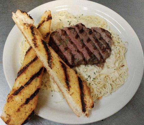 NY Strip Alfredo over Angel Hair Pasta served w/ a side salad