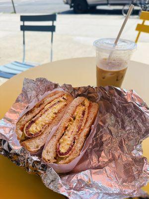 Pastrami egg and cheese on a roll ($6.50) and Iced Coffee ($3.00)