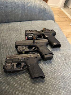 Walther pdp with a optic and a laser light 9mm A Glock 30s with a laser light 45acp A M&P shield plus with a laser light 9mm