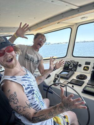 Rusty pretending no one was driving the boat when my son was showing 'no hands'