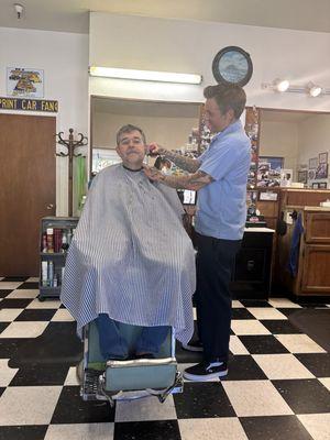 Sexy beast getting his beard trimmed.