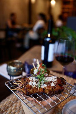 Gai Gor Lae
grilled marinated southern style chicken skewers with coconut milk, fried garlic, and kaffir lime leaves (S)